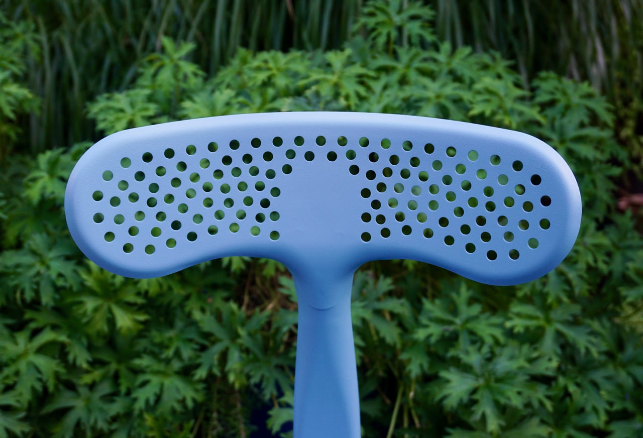 Outdoor chair by Chaises Nicolle, designed by Paola Navone, featuring a perforated whale tail pattern. Perfect for the Milan Fuori Salone exhibition.