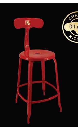 Red stool on a black background.